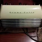 back of espresso machine - looks like a 50's car.webp